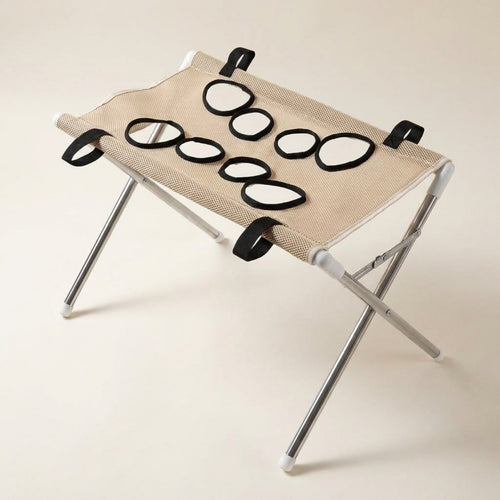 Pawperch pet washing and grooming stand in coffee beige, showing the eight black-rimmed leg holes and folding metal frame